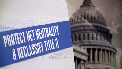 A sign on display during a news conference on Capitol Hill on Feb. 4. 2015. Senate Democrats are calling on the Federal Communications Commission to reclassify the transmission component of broadband Internet access as a telecommunications service under Title II of the Telecommunications Act. to prevent broadband providers from creating Internet fast lanes for those who can pay and enforce open internet protections. (Photo by Mark Wilson/Getty Images)