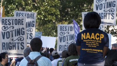 Various labor unions and progressive organizations protest on Capitol Hill Sept. 16, 2015, calling for the restoration of the Voting Rights Act struck down by the US Supreme Court. (Photo by Paul J. Richards/AFP/Getty Images)