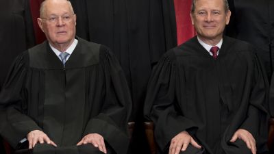 Chief Justice of the United States John G. Roberts (right) and US Supreme Court Associate Justice Anthony M. Kennedy (left) in an official photo in 2017. (Photo by Saul Loeb/AFP/Getty Images)