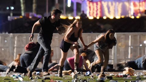 People run from the Route 91 Harvest country music festival after gun fire was heard on Oct. 1, 2017 in Las Vegas. A gunman opened fire on a music festival, leaving at least 59 people dead and more than 500 injured. (Photo by David Becker/Getty Images)