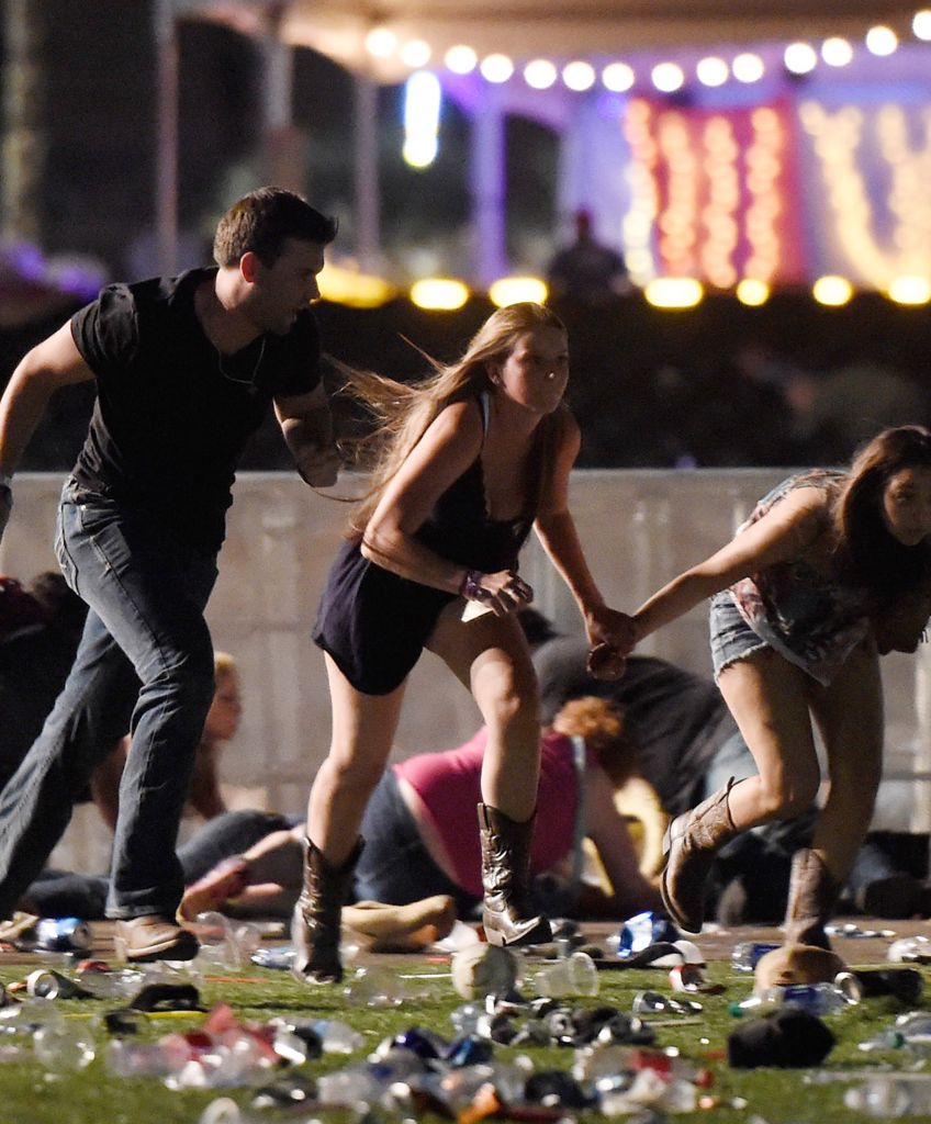 People run from the Route 91 Harvest country music festival after gun fire was heard on Oct. 1, 2017 in Las Vegas. A gunman opened fire on a music festival, leaving at least 59 people dead and more than 500 injured. (Photo by David Becker/Getty Images)