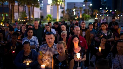 Mourners attend a candlelight vigil at the corner of Sahara Avenue and Las Vegas Boulevard for the victims of Sunday night's mass shooting on Oct. 2, 2017 in Las Vegas. (Photo by Drew Angerer/Getty Images)