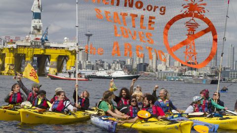 Environmental activists in kayaks protest the arrival of the Polar Pioneer, an oil drilling rig owned by Shell Oil, in Seattle. The rig is part of a fleet that will lead a controversial oil-exploration effort off Alaska's North Slope. (Photo by Backbone Campaign/Karen Ducey/Getty Images)/ flickr CC 2.0)