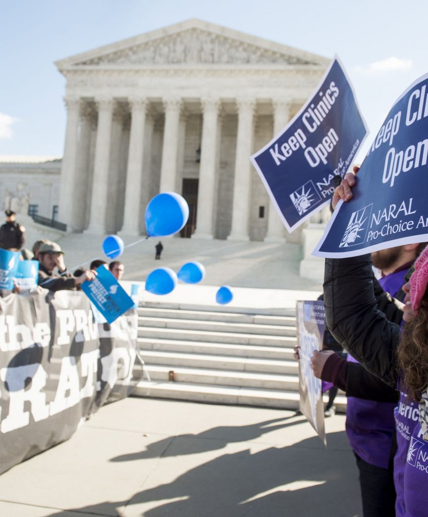Supporters of legal access to abortion and anti-abortion activists rally outside the Supreme Court in Washington, DC on March 2, 2016, as the court hears oral arguments in the case of Whole Woman's Health v. Hellerstedt, which deals with access to abortion. (Photo by Saul Loeb/AFP/Getty Images)