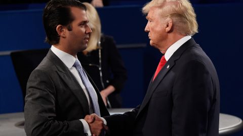 Donald Trump Jr. greets his father during the Oct. 9, 2016 presidential debate in St. Louis. (Photo by Saul Loeb-Pool/Getty Images)