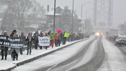 In Kittery, Maine, this weekend, there was a march to demand that Sen. Susan Collins vote no on the tax bill. (Photo courtesy of People's Action)