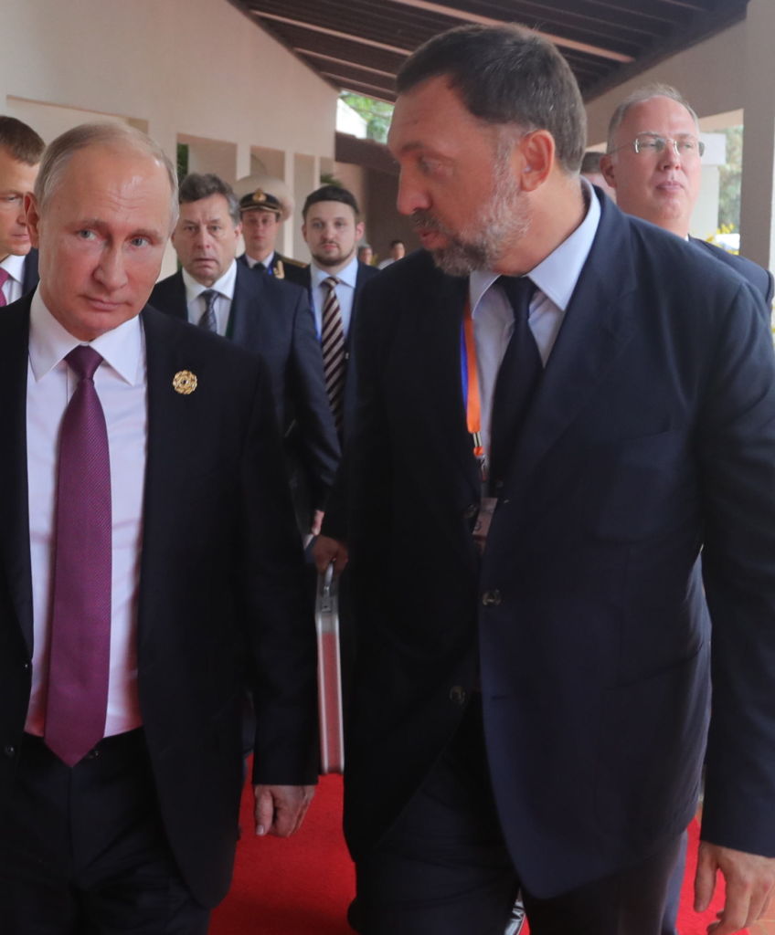 Russia's President Vladimir Putin (L) talks to Rusal President and Management Board Member Oleg Deripaska at the 2017 Asia-Pacific Economic Cooperation (APEC) summit. (Photo by Mikhail KlimentyevTASS via Getty Images)