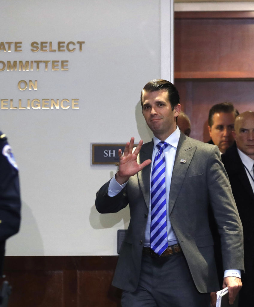 Donald Trump Jr., executive vice president of Trump Organization Inc., center, exits an interview with the Senate Intelligence Committee on Capitol Hill in Washington, DC on Wednesday, Dec. 13, 2017. (Photo by Aaron P. Bernstein/Bloomberg via Getty Images)