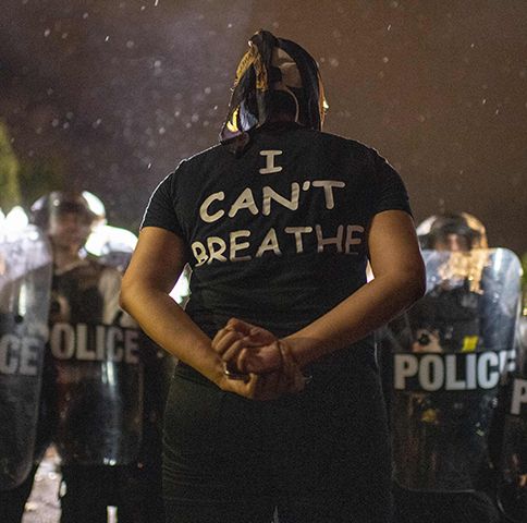 Protesters face off with police outside the White House in Washington, DC, early on May 30, 2020 during a demonstration over the death of George Floyd, a black man who died after a white policeman knelt on his neck for several minutes. - Violent protests erupted across the United States late on May 29 over the death of a handcuffed black man in police custody, with murder charges laid against the arresting Minneapolis officer failing to quell boiling anger. (Photo by Eric BARADAT / AFP) (Photo by ERIC BARADAT/AFP via Getty Images)