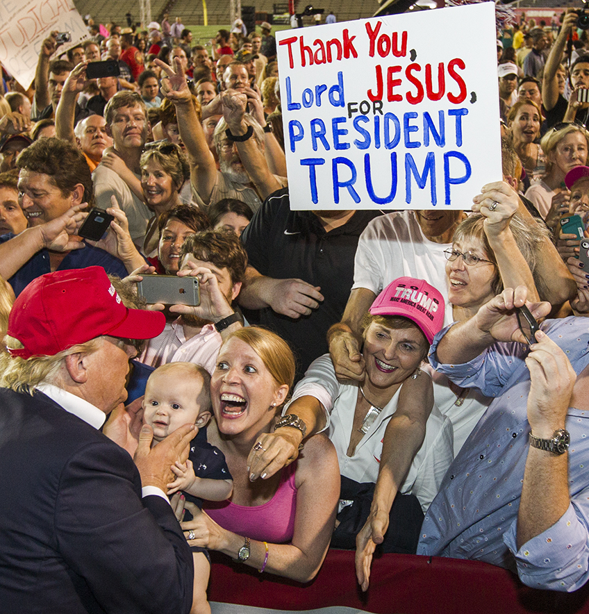 Republican presidential candidate Donald Trump greets supporters after his rally at Ladd-Peebles Stadium on August 21, 2015 in Mobile, Alabama. The Trump campaign moved tonight's rally to a larger stadium to accommodate demand. (Photo by Mark Wallheiser/Getty Images)
