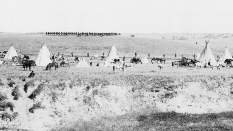 U.S. troops surrounding the Indians on Wounded Knee battle field / Miller Studio, Gordon, Neb.