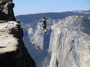 Man highlining at Taft Point, Yosemite National Park, with El Capitan in the background. (Credit: LiAnna Davis, CC 2.0)