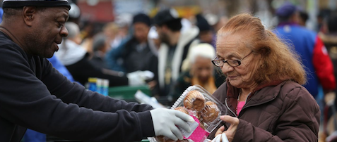Brooklyn residents receive free food as part of a Bowery Mission outreach program on December 5, 2013 in the Brooklyn borough of New York City. (Photo by John Moore/Getty Images) food pantry